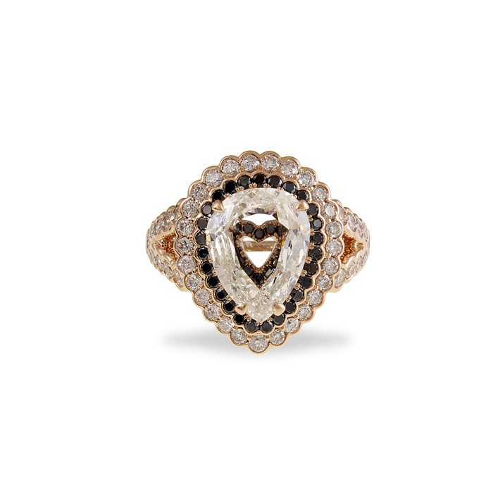 CASE Award for Jewelry $10,000 & Over (retail) Hand-fabricated 14K rose gold ring featuring a 2.52 carat rose cut pear center stone surrounded by round cut diamonds (1.45 ctw) and round black diamonds (0.34 ctw). Roussel's Fine Jewelry & Gifts , Gramercy, LA Designed by Jess Roussel