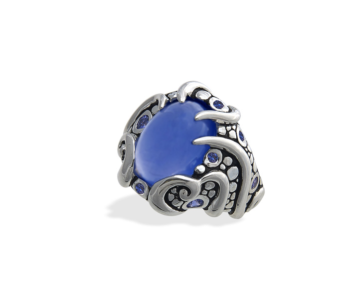CASE Award for Buyers' Choice Sterling silver ring featuring an 8.70 carat oval blue chalcedony cabochon with 10 lavender round cut sapphires (0.61 ctw). Khamis Fine Jewelers , Indianapolis, IN Designed by Lisa Perantoni *Also won first place in Jewelry Up to $2,000 (retail) category.