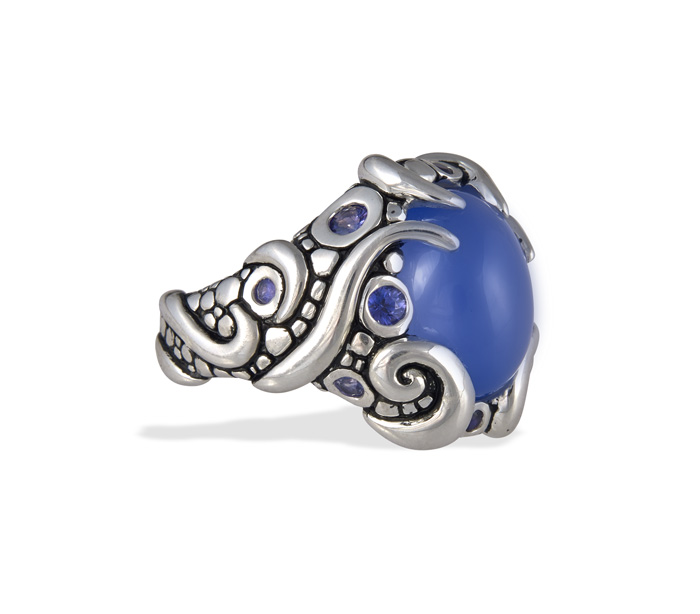 CASE Award for Jewelry Up to $2,000 (retail) Sterling silver ring featuring an 8.70 carat oval blue chalcedony cabochon with 10 lavender round cut sapphires (0.61 ctw). Khamis Fine Jewelers , Indianapolis, IN Designed by Lisa Perantoni *Also won first place in Buyers' Choice category.