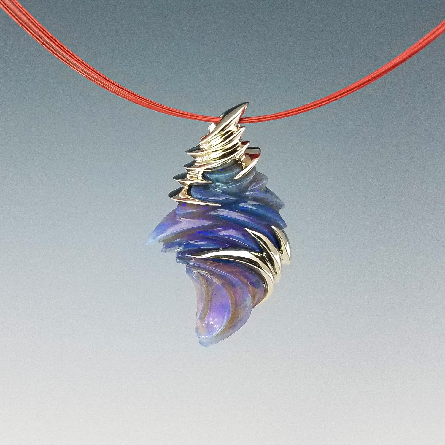 Retailer: Jewelry $2,001 to $5,000 15.86 carat carved Australian opal pendant set in 14K white gold Jeweler: Mike Anderson Brody Designs Plover, WI