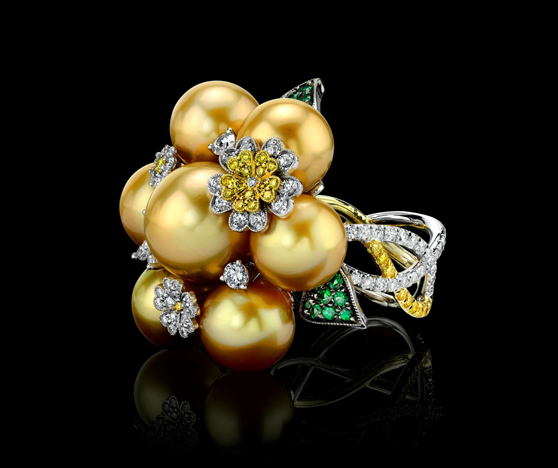 Supplier: Jewelry $2,001 to $5,000 18K white and yellow gold ring with fancy yellow and white brilliant cut diamonds, green garnet and south sea golden Pearls Jeweler: Jack Ferrero Jack Ferrero Inc. Los Angeles, CA