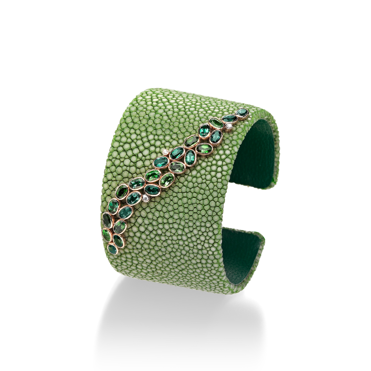 Bracelets up to $5,000 Green galuchat cuff with a branch of green oval cut tourmalines (5.36 ctw) and white brilliant cut diamonds (0.05 ctw) in 18K fair trade rose gold Designed by: Hans Schullin Schullin Graz, Austria $2,900