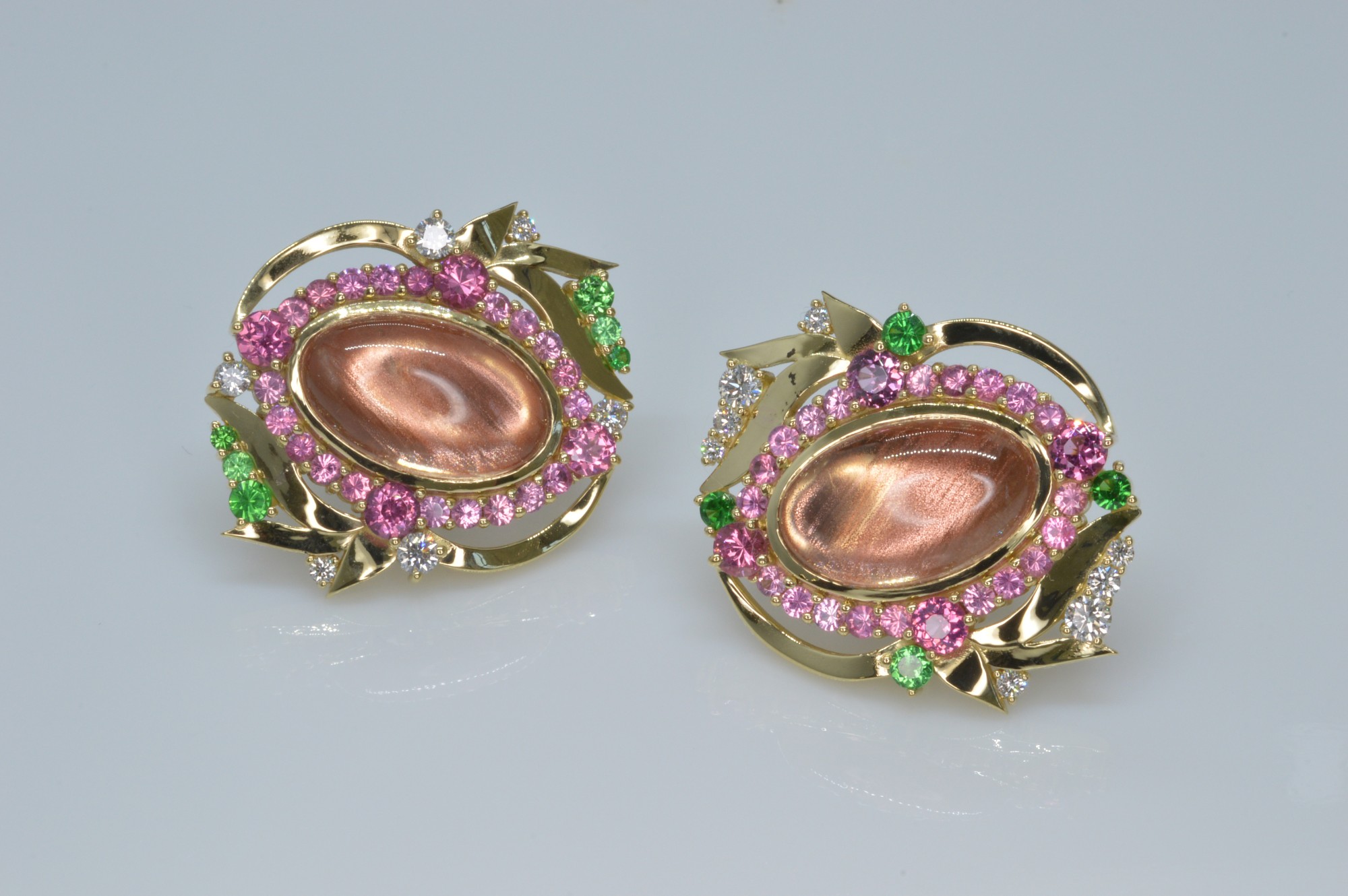 Pins/Brooches/Cufflinks (any price) Fine Oregon Sunstones from the Dust Devil mine in Plush Oregon (14.96ctw) surrounded by pink spinels (3.70 ctw) and accented by tsavorites (.91 ctw) and round diamonds (.56 ctw) in 18K yellow gold Designed by: Sharon Curtiss-Gal The Gem Vault Flemington, NJ $13,000