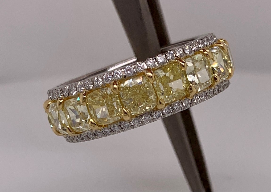 Wedding Bands $5,001 and Up Platinum and 18K yellow gold accent ring with 18 natural fancy light yellow diamonds -- 6.8cts of Sunny Yellow Diamonds and 0.48cts of Vanilla Diamonds® Designed by: Moossa LeVian LeVian Great Neck, NY $42,400