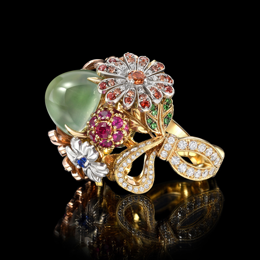 Supplier: Jewelry $10,001 to $50,000 18K three tone yellow, white and rose gold flower ring featuring a 9.44 carat green moonstone with white diamonds, fancy yellow diamonds, green garnet, ruby, and multi-colored sapphires Designed by: Arman Agekyan Jack Ferrero Inc Los Angeles, CA $27,000