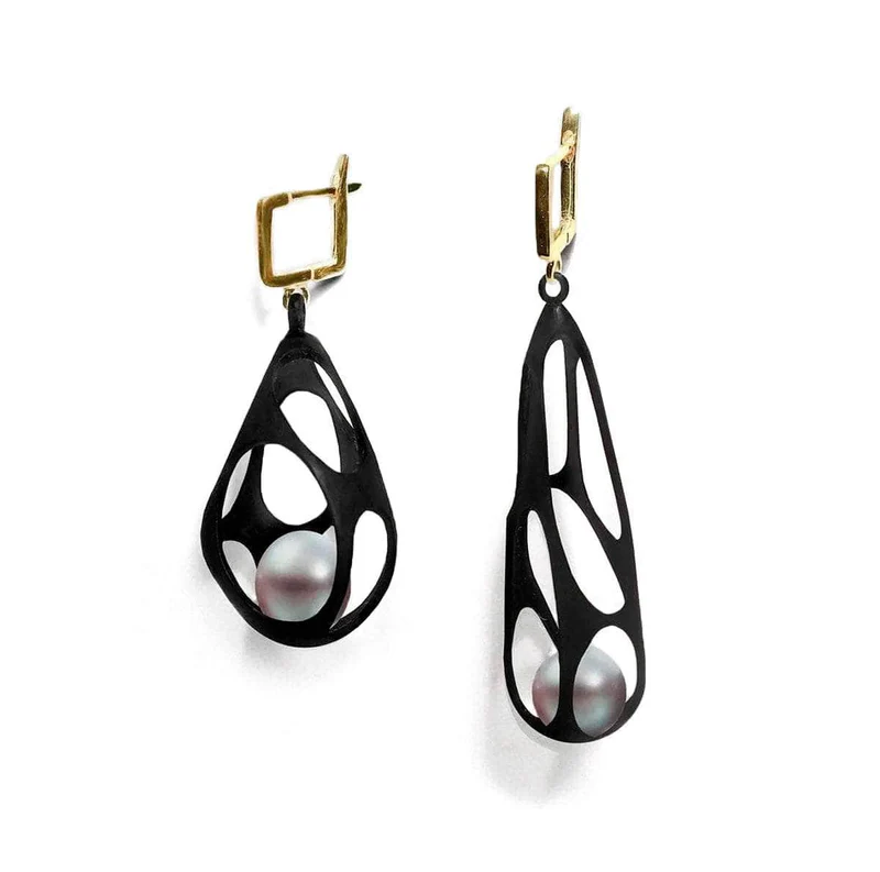 Retailer: Jewelry up to $5,000 Riona Pearl Earrings in sterling silver with white shell pearls, plated in 18K yellow gold and black anthracite Designed by German Kabirski German Kabirski Lake Worth, FL