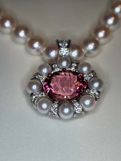 RETAILER: $20,001-$75,000 12.63ct pink tourmaline set in 14K rose gold with 2.70 carats of diamond rondels and Akoya Pearls set on a pearl strand Michael Ryan Personal Jeweler Designed by Michael Ryan Snuggs, Patrick Conway and Mark Gronlund Birmingham, AL