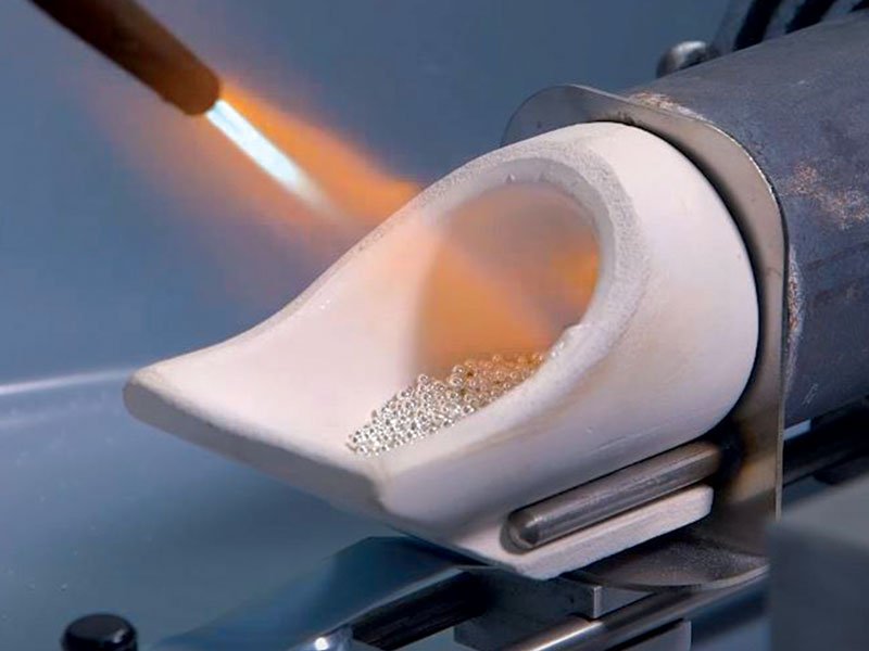 Heating metal in a centrifugal casting machine