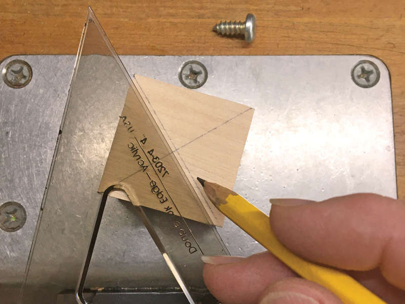 Detail Step 2 marking the center of the wooden block