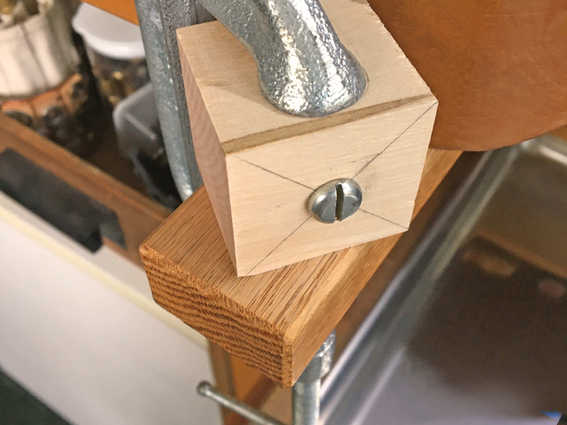Step 4 block attached to jewelry bench armrest with a C-clamp