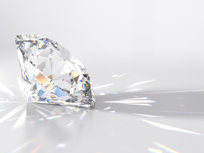 Diamond with light reflections on a surface