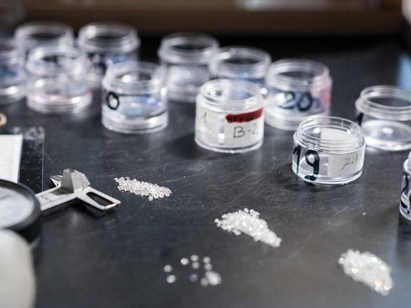 Separating natural and lab-grown diamonds in a lab.