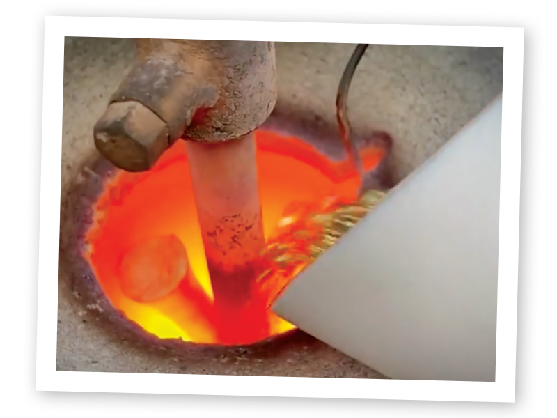 pouring molten metal in jewelry casting